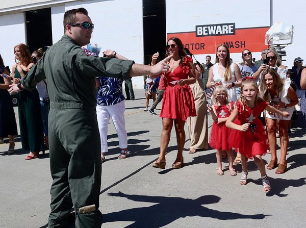 NAS Lemoore squadrons return home after a long seven-month deployment An attendant can't keep children away from their returning fathers as a pair Naval Air Station squadrons return home after a long deployment.